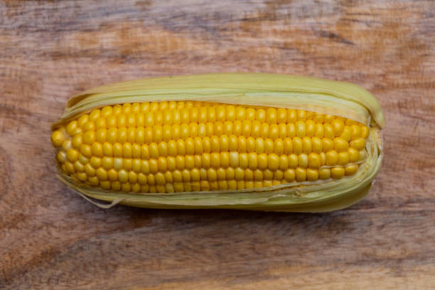 istock Ripe corn cob on wooden table 1026555132