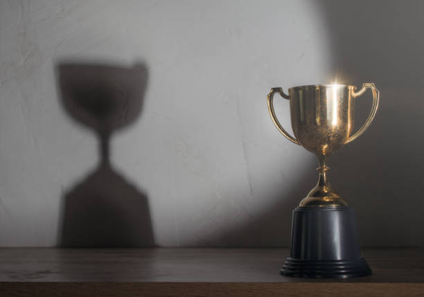 istock champion golden trophy placed on wooden table 1026555168