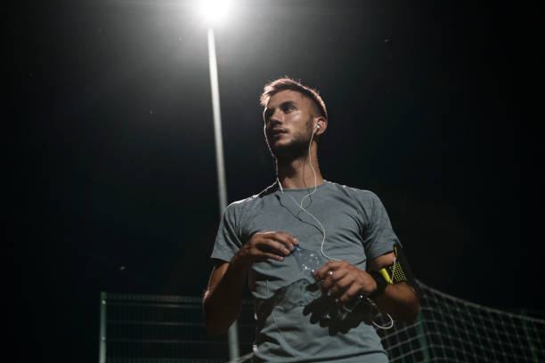 istock Young man drinking water after jogging 1026555990