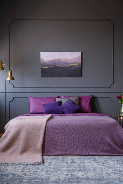Elegant hotel room real photo with painting on the wall and a big bed in the center Elegant hotel room real photo with painting on the wall and a big bed in the center metal molding stock pictures, royalty-free photos & images