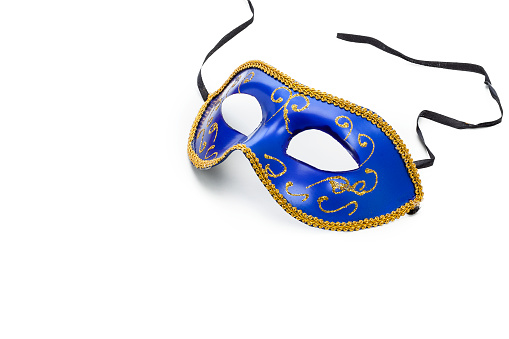 Masquerade mask isolated on white background. The mask is placed at the top-right of an horizontal frame leaving useful copy space for text and/or logo. Predominant colors are blue and white. High key DSRL studio photo taken with Canon EOS 5D Mk II and Canon EF 100mm f/2.8L Macro IS USM.