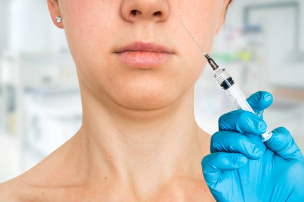 istock Woman gets injection in her face - cosmetic concept 1026565818