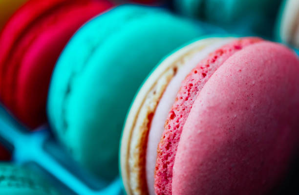 istock Assorted macaroons sweets, close up, backdrop. Marine, pink and violet. 1026567102