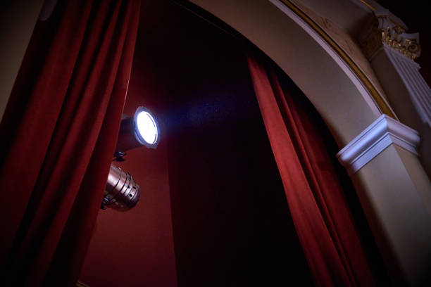 istock Arch with curtains and a luminous searchlight 1026572006