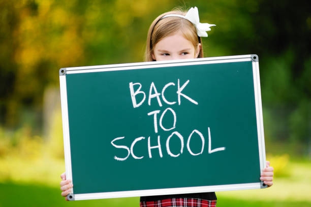 istock Adorable little girl feeling exited about going back to school 1026572492