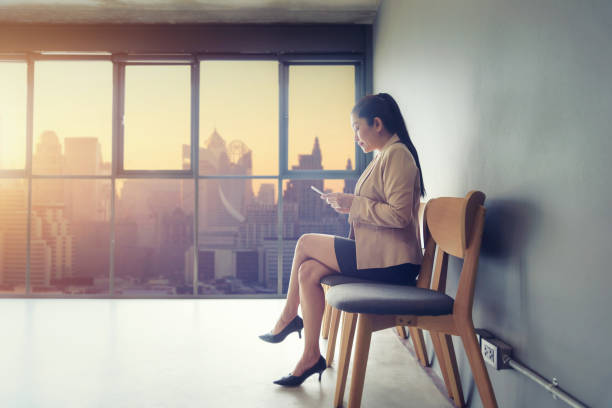 istock Business woman using laptop computer in a modern office 1026572590
