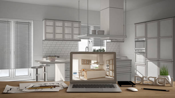 istock Architect designer desktop concept, laptop on wooden work desk with screen showing interior design project, blurred draft in the background, contemporary kitchen idea template 1026572738