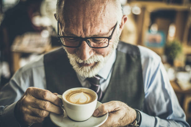 istock Close up image of senior businessman drinking coffee. 1026572848