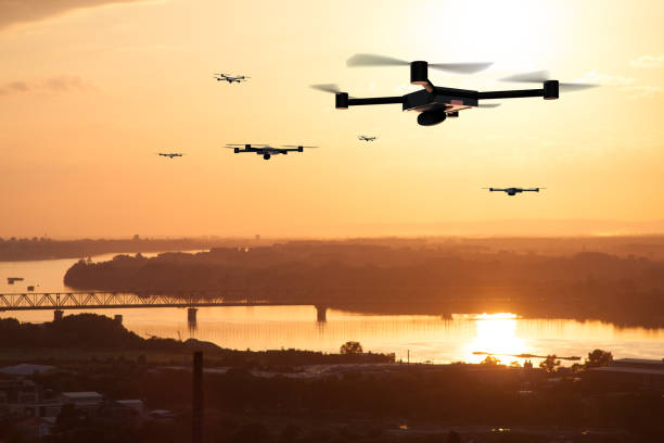 photographier avec drone aérien - flying over photos et images de collection