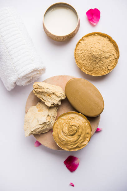 istock Herbal or Ayurvedic face Pack using Multani mitti, milk etc placed with Soap, towel. Selective focus 1026586202