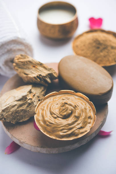 istock Herbal or Ayurvedic face Pack using Multani mitti, milk etc placed with Soap, towel. Selective focus 1026586252