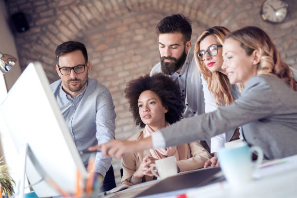 istock Business team sitting in office and planning work 1026586956
