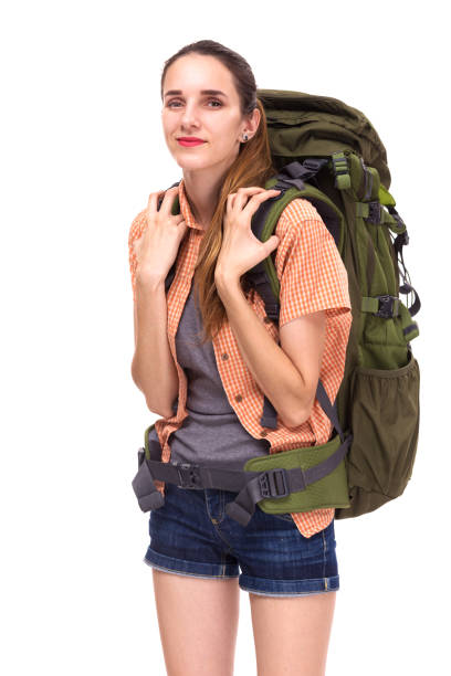 istock Young beautiful woman with big travel backpack, looking to camera 1026592886