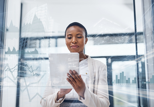 Multiple exposure shot of a mature businesswoman using a digital tablet in a boardroom superimposed on a cityscape