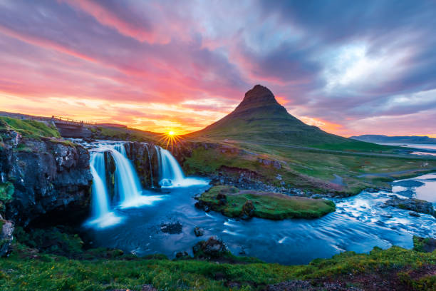 istock Colorful sunrise on Kirkjufellsfoss waterfall 1026594150