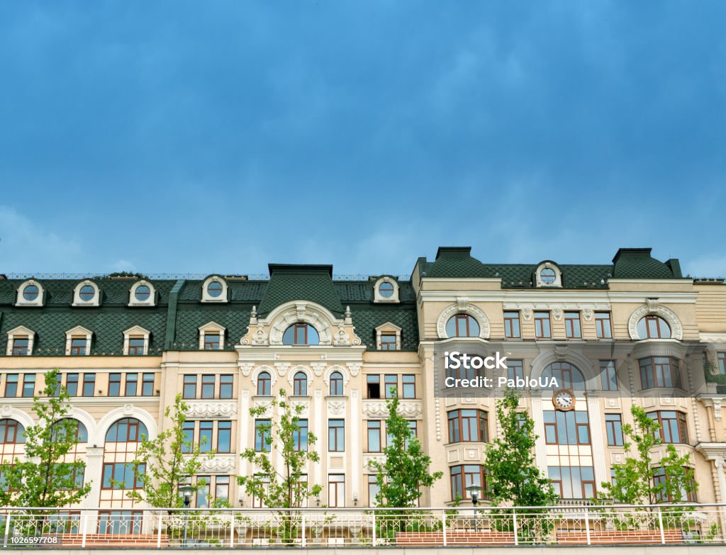 front of modern buildings with terrace benches and trees front of modern buildings townhouse with terrace benches and trees at closed living territory Apartment Stock Photo