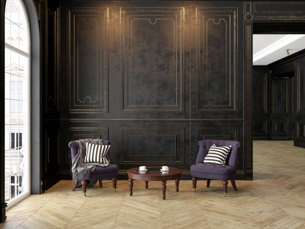 istock Armchairs and coffee table in classic black-gold interior. 1026603236