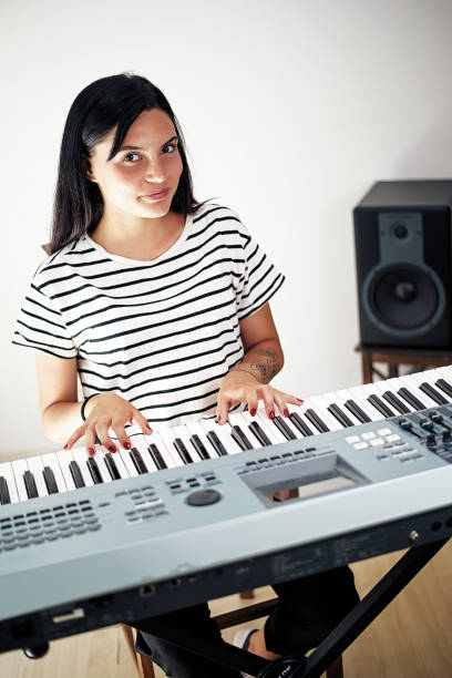 istock Young girl playing the piano 1026604062