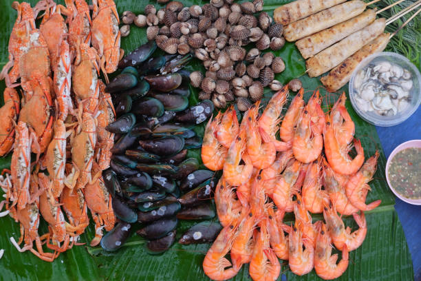 istock Premium Thai seafood on banana leaf (crabs, shrimp, oysters, mussels, cockles) 1026607642