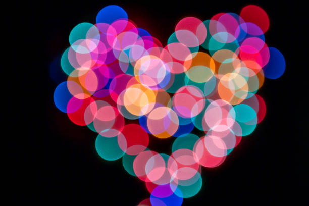 istock Abstract background with heart shape bokeh defocused lights and shadow 1026607756