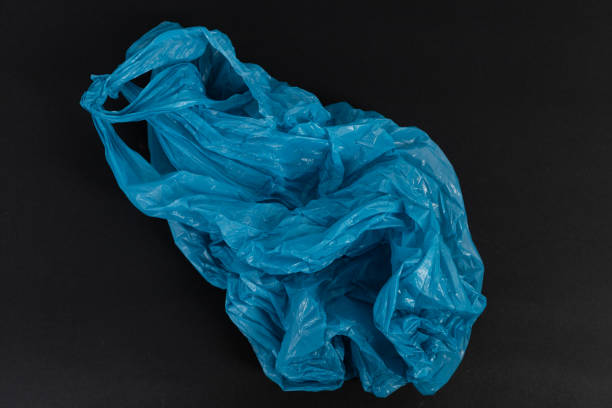 istock Old used crumpled blue shopping plastic or garbage bag 1026610568