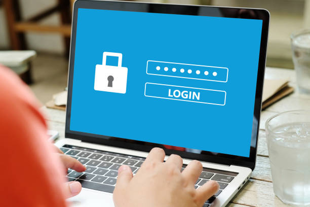 istock Hand tying laptop computer with password login on screen, cyber security concept 1026610742