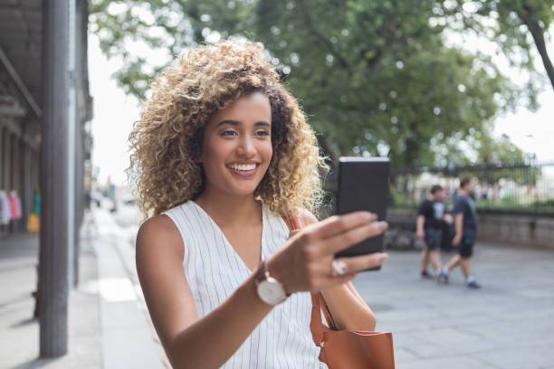istock Attractive young woman taking selfie 1026611492