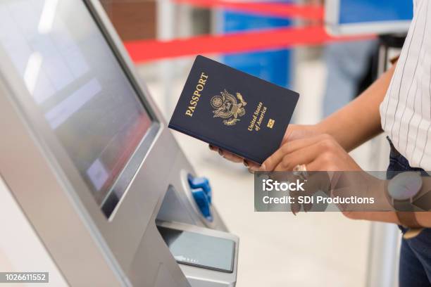 Woman Uses Automated Passport Control Kiosk Stock Photo - Download Image Now - Passport, USA, Computer