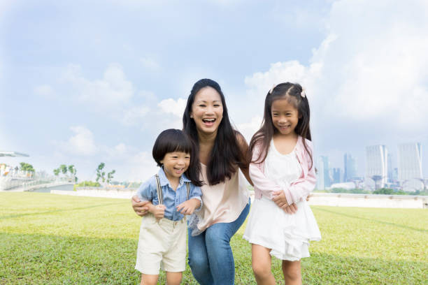istock Mom enjoys playing with her young children 1026611598