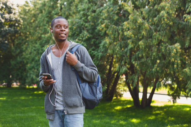 istock Happy african-american student texting in university campus 1026617764