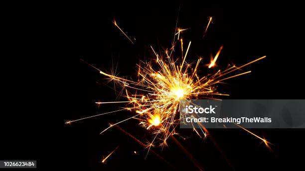 Close Up Several Firework Sparklers Over Black Stock Photo - Download Image Now - Sparks, Black Background, Glittering
