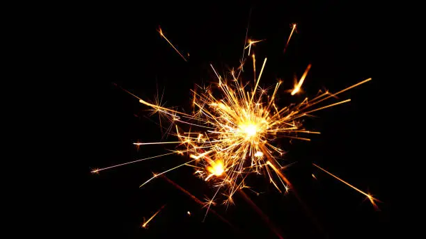 Photo of Close up several firework sparklers over black