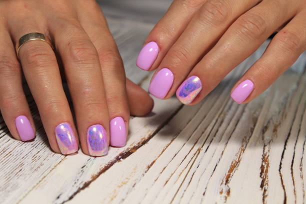 istock glamorous beautiful manicure on a trendy texture background 1026623952