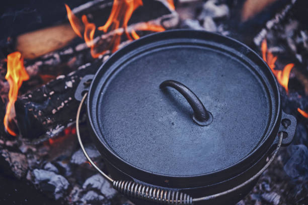 istock Cooking Chili Con Carne in Dutch Oven over Logfire 1026630754