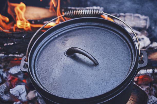 istock Cooking Chili Con Carne in Dutch Oven over Logfire 1026630760