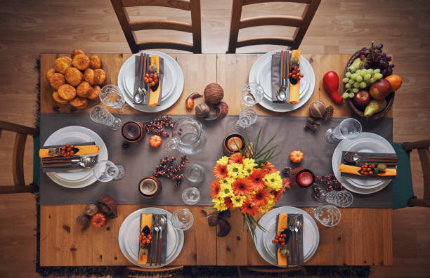 istock Decorated Table for Thanksgiving Dinner with Candles, Pumpkins, Leafs and Nuts 1026631380