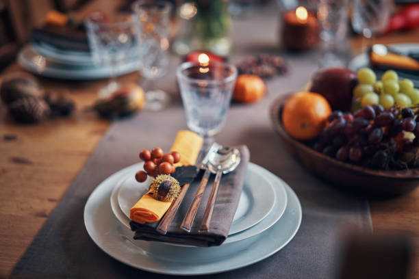 istock Decorated Table for Thanksgiving Dinner with Candles, Pumpkins, Leafs and Nuts 1026631382