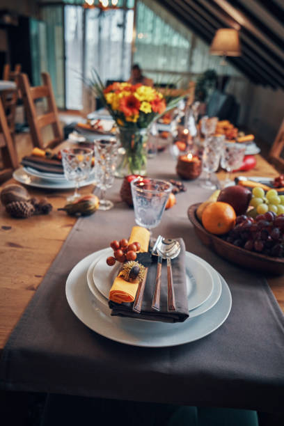 istock Decorated Table for Thanksgiving Dinner with Candles, Pumpkins, Leafs and Nuts 1026631406