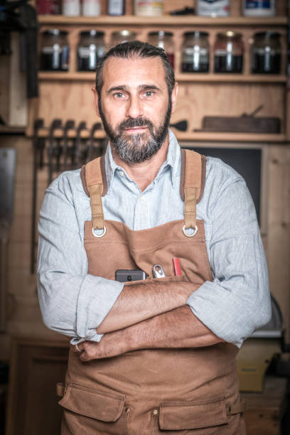 istock portrait of caucasian carpenter in workshop 1026636698