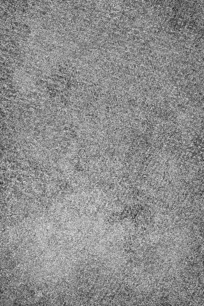 istock Grunge background black and white. Abstract monochrome texture. Pattern of cracks, chips, scuffs, scratches, cracks. Vintage dirty surface covered with dust and stains 1026645446