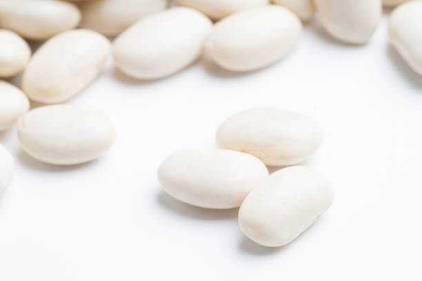 istock heap of white beans isolated on white background 1026648004