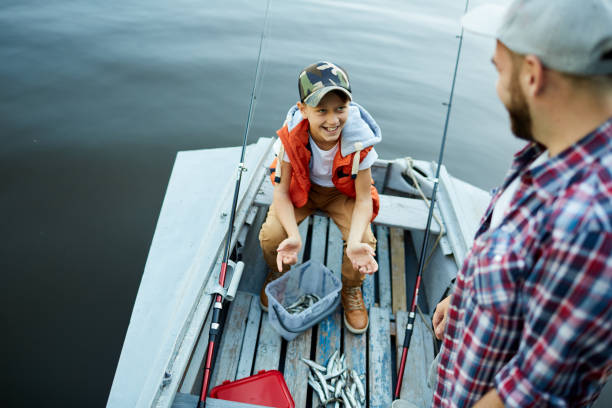 istock Dad and son in the boat 1026652636