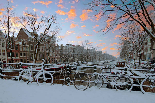 istock Amsterdam covered with snow  in winter in the Netherlands at sunset 1026656068