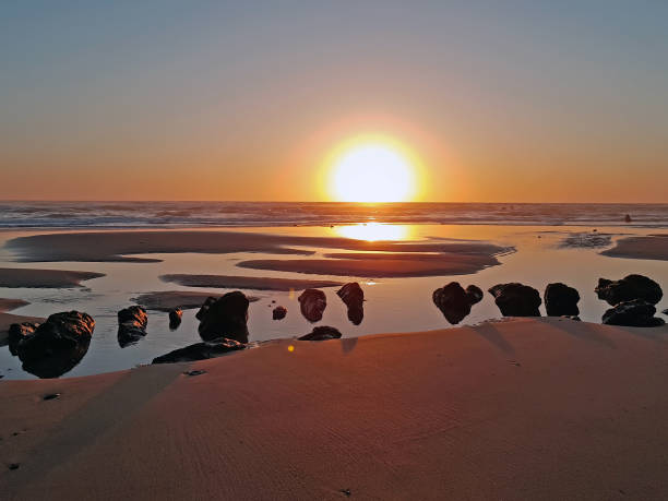 istock Natural rocks in the water from the atlantic ocean at sunset 1026656208