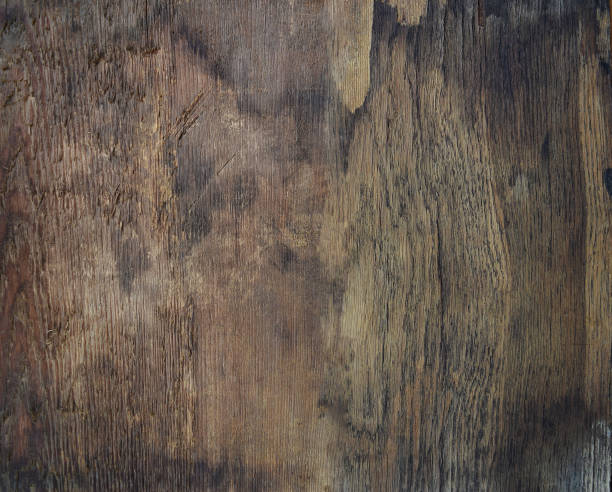 istock Old dark rough wooden board. Top view. 1026660116