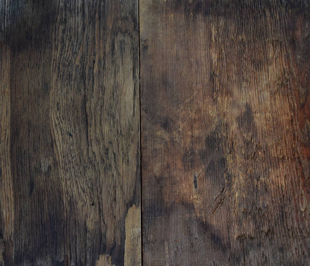 istock Old dark rough wooden board. Top view. 1026660180