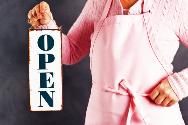 istock store sign, open for business sign held 1026667078