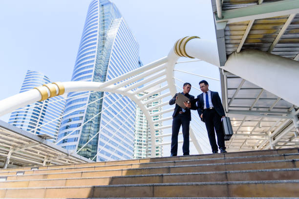 istock Two asian businessman has talking for business vision. 1026671614