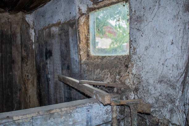 istock Village. Rural. A wall with a window in an old abandoned barn. 1026672504