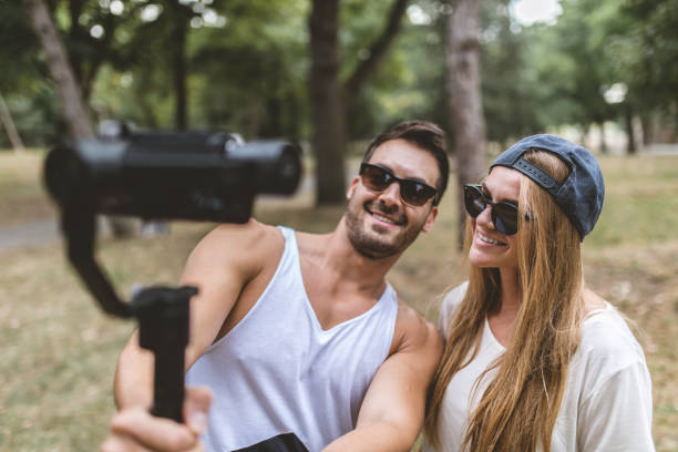 istock Handsome vloggers out in a forest filming 1026679742